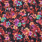 Coton imprimé fleuri graphique rouge, fuchsia et turquoise fond noir