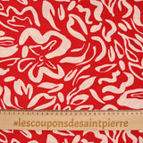 Jersey de polyester imprimé formes de fleurs écru fond rouge