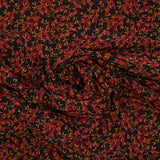 Mousseline imprimée feuilles rouge et ocre fond noir