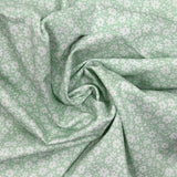 Piqué de coton imprimé fleurs printanière fond vert