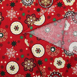 Popeline de coton imprimée médaillons et flocons de Noël fond rouge