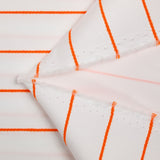 Sergé de polyester rayures brodées orange fond blanc