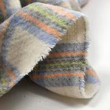 Brushed wool blend in ecru, blue, gray, orange and green checks
