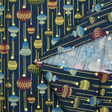 Cotton poplin printed with vintage Christmas baubles on a midnight blue background