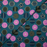 Cotton poplin printed with festive balls and golden flashes on a duck background