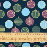 Cotton poplin printed with festive balls and golden sparkles on a navy blue background