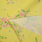 Crêpe polyester imprimé fleur rose fond jaune soufre