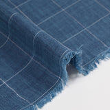 Coton tissé teint carreaux trait blanc fond bleu chiné