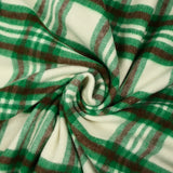 Brushed polyester wool with green and brown checks on an ecru background