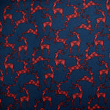Cotton flannel printed with red deer on navy blue background