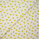 Jersey pointelle coton imprimé citron fond blanc cassé