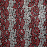 Fino encaje de poliéster bicolor rojo y negro.