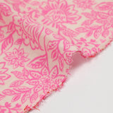 Double gauze printed with pink flowers on an ecru background