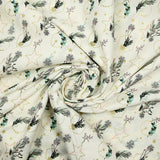 Cotton poplin printed with winter branches, golden balls and stars on an ecru background