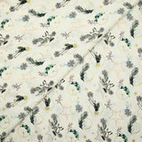 Cotton poplin printed with winter branches, golden balls and stars on an ecru background
