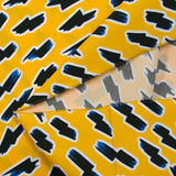 Popeline de coton BIO imprimée éclair fond jaune