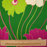 Viscose twill printed with anise and fuchsia flowers on a meadow green background