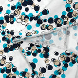 Satin de coton élasthanne dans les bulles turquoise fond blanc