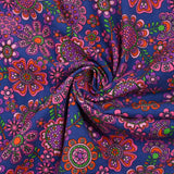 Velours de coton côtelé imprimé fleurs psychédéliques fond indigo