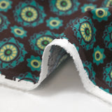 Velours de coton côtelé imprimé rosaces turquoise fond marron
