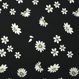 Cotton gabardine with daisy print on black background
