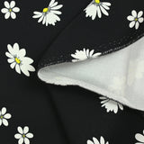 Cotton gabardine with daisy print on black background