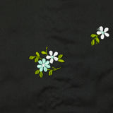 Polyester satin embroidered water green flowers on black background