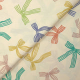 Cotton printed ribbon bows with ecru background