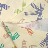 Cotton printed ribbon bows with ecru background
