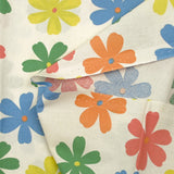 Algodón estampado con flores de Ninon sobre fondo crudo