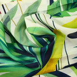 Green jungle print cotton voile with off-white background