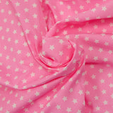 Algodón estampado estrellas 1cm rosa