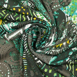 Maille crêpe imprimée patchwork ethnique turquoise et vert fond kaki
