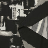 Jersey imprimé illusion grège et blanc cassé fond noir