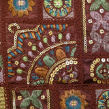 Satin lourd brodé et sequins patchwork fond bordeaux au mètre