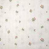 Punto pointelle de algodón con estampado de tulipanes, fondo blanquecino