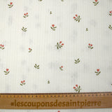Punto pointelle de algodón con estampado de tulipanes, fondo blanquecino