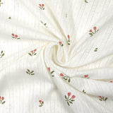 Punto pointelle de algodón con estampado de tulipanes, fondo blanquecino