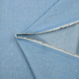 Cotton chambray decorated with rhinestones on a sky blue background