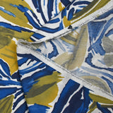 Crepe de viscosa estampado selva anís y fondo blanco azul