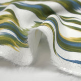 Viscose crepe printed abstract waves green and blue white background