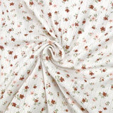 Jersey pointelle coton imprimé envolée de fleurs rose et brique fond blanc cassé