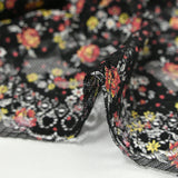 Dentelle imprimée fleurs rouge et jaune fond noir