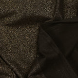 Fine iridescent gold jersey, black background