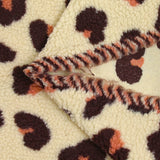Piel sherpa sintética de leopardo fondo salmón y ciruela crudo