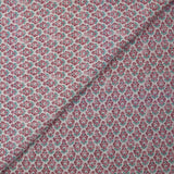 Textured muslin printed with purple and turquoise floral medallions on a white background