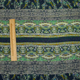 Crinkle chiffon printed with ornamental friezes in sea green and navy background