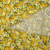 Crepe georgette estampado con pato y flores amarillas