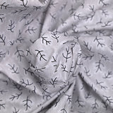 Popeline polycoton imprimée rayée et branche fond gris