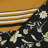 Satin polyester twill printed with ecru flowers and ocher border, black background